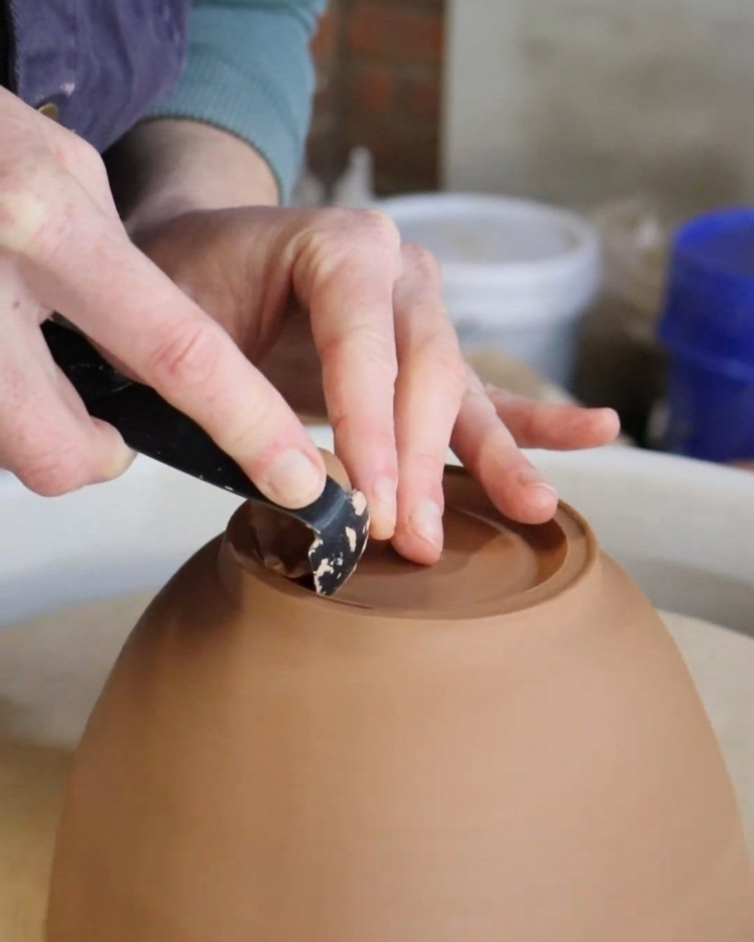 Trimming a bowl on the pottery wheel