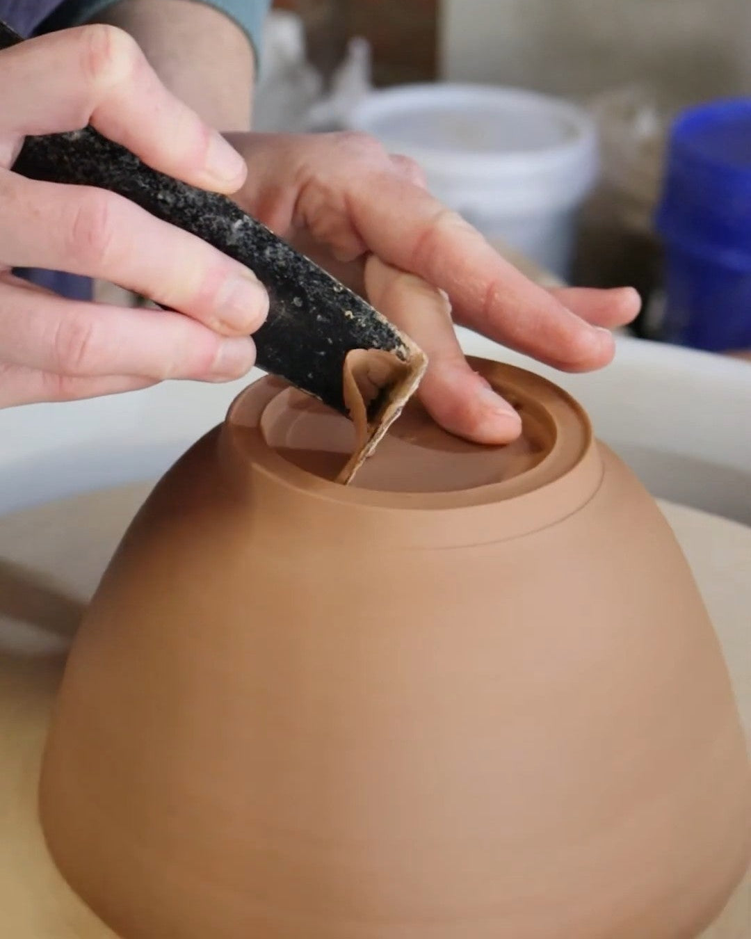 Trimming a bowl on the pottery wheel
