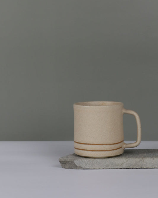Oatmeal ceramic cup on a gray background