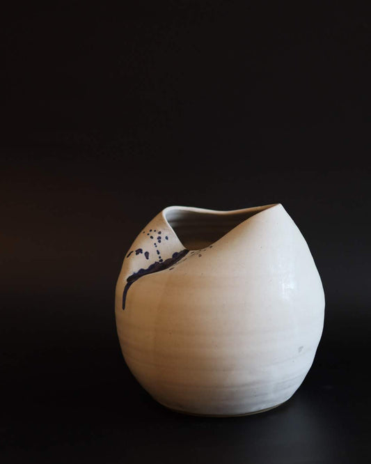 Manipulated ceramic sculpture on a black background