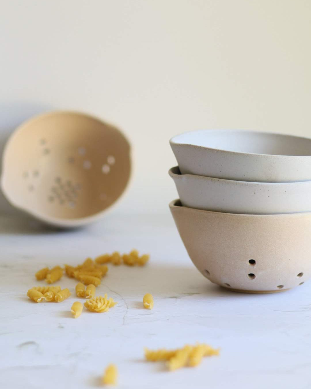 stack of three ceramic berry bowls
