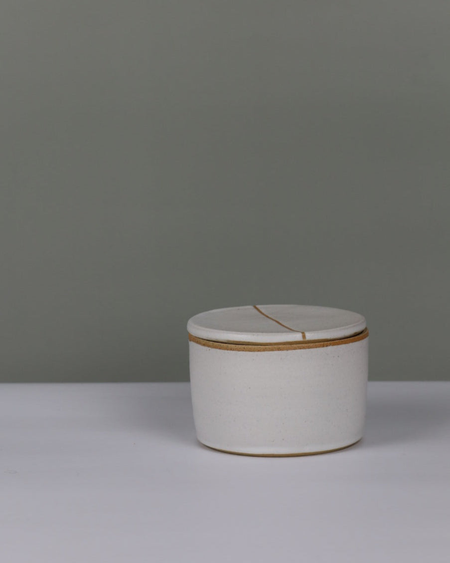 white butter bell on a grey background