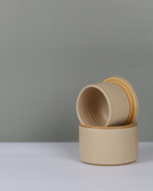 ceramic butter crock on a grey background