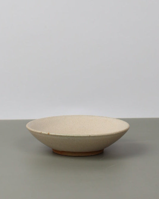 ceramic dish on a grey table