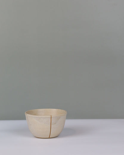 small beige ceramic bowl