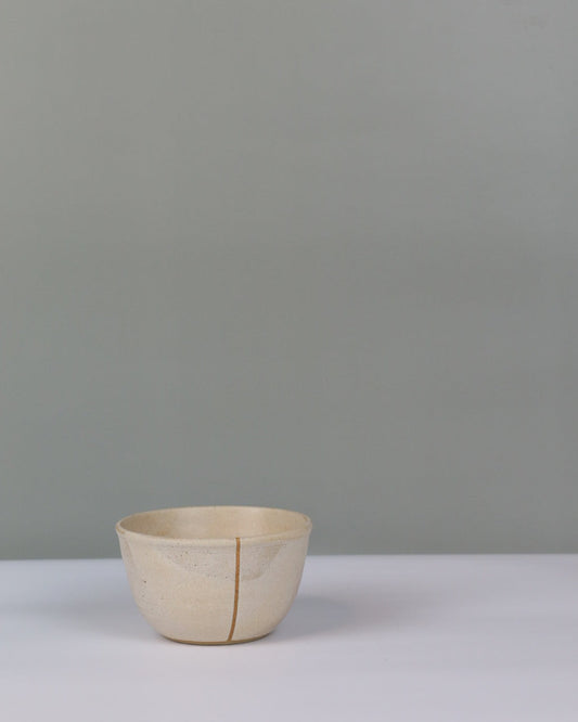 small beige ceramic bowl