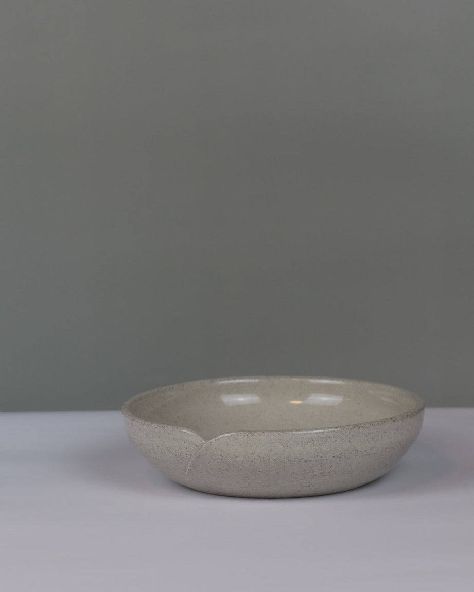 ceramic serving dish on a grey background