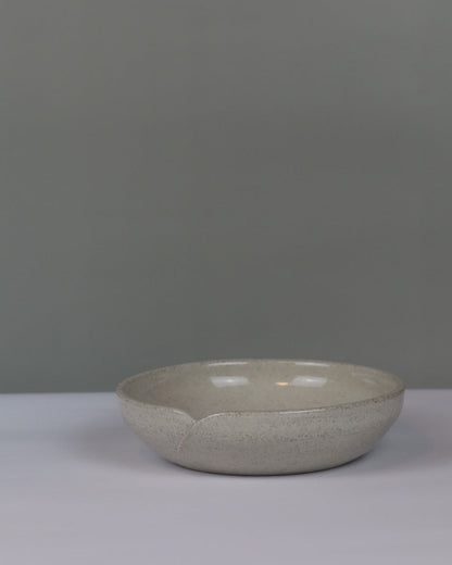ceramic serving dish on a grey background