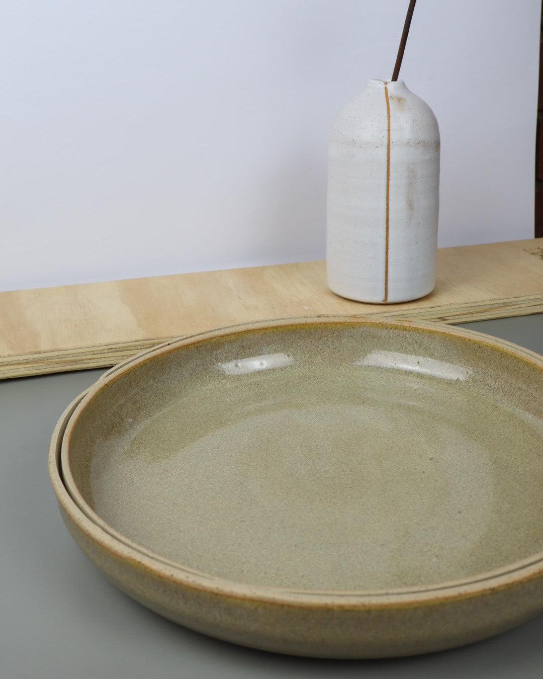 Ceramic bowl on a white surface with a neutral background