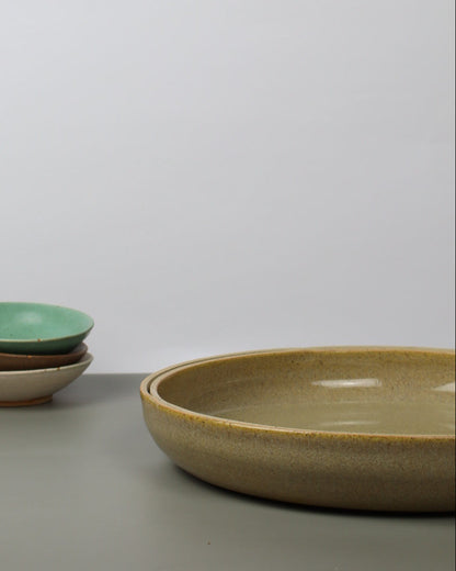 ceramic bowls on a white wall.