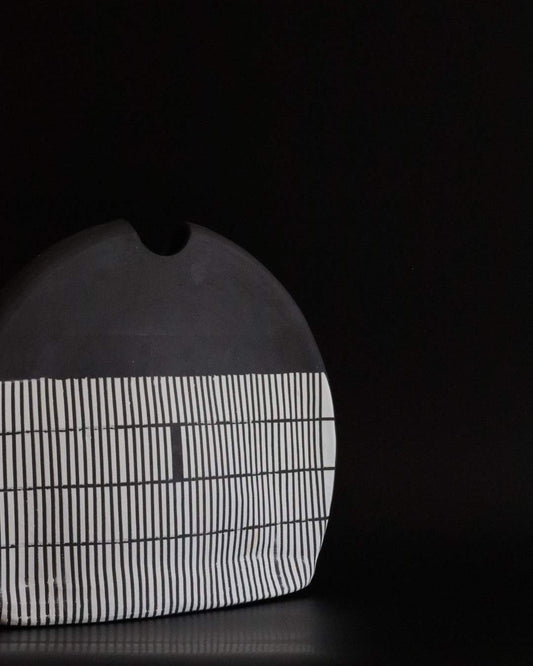 Black ceramic vessel with geometric block design