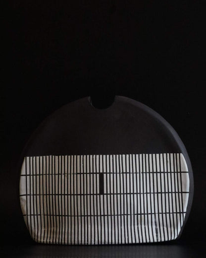Black ceramic vessel with geometric block design