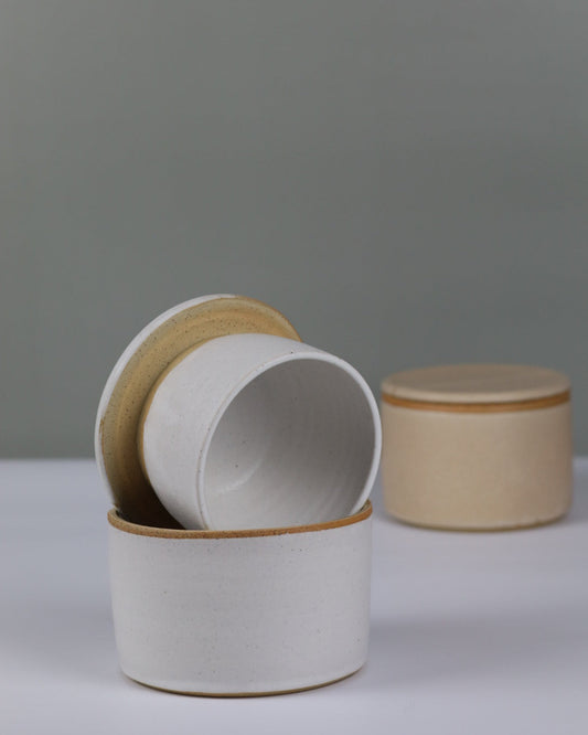 white butter bell and beige butter bell in background
